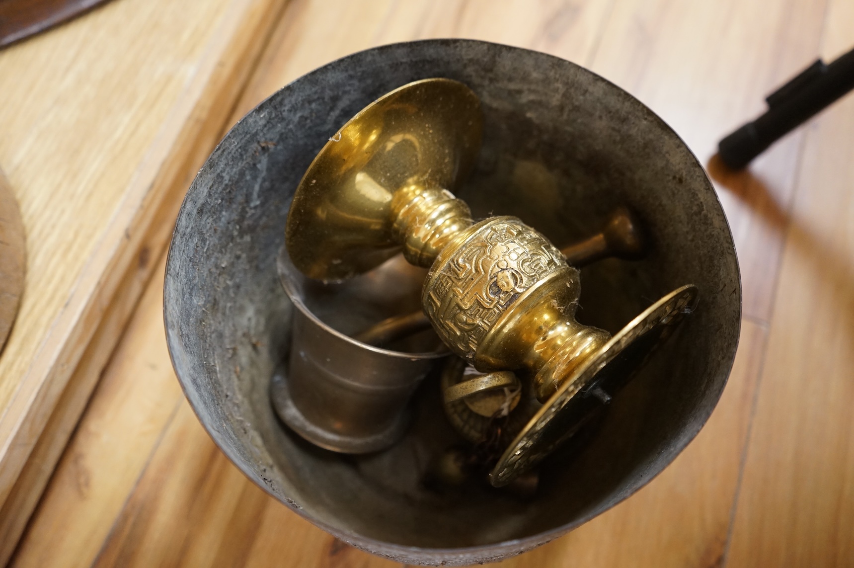 A collection mixed metal ware to include table lamps planters and a pestle and mortar
